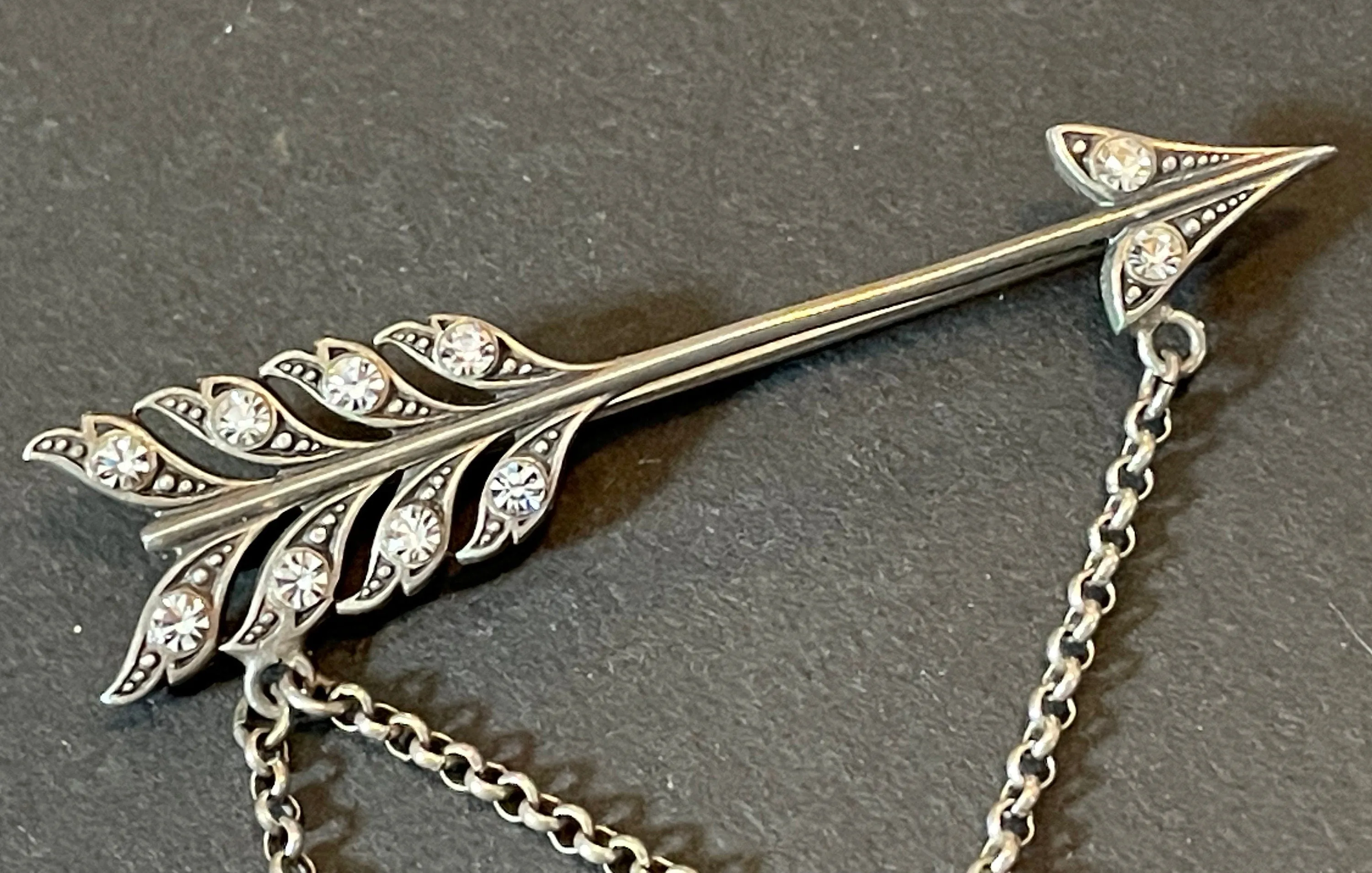 Large early Askew London, vintage cupid's arrow love brooch in antique silver tone with rhinestones, cherub, heart locket and key