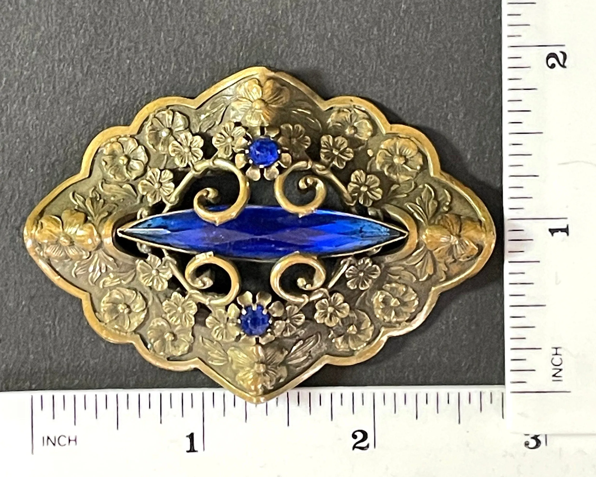 Large vintage Art Nouveau to Art Deco sapphire blue rhinestone & ornate gold tone three dimensional floral design Czech brooch, Neiger style